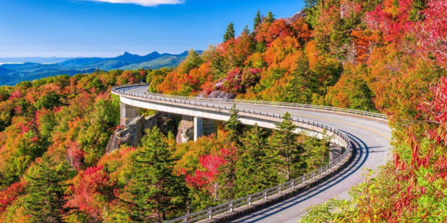 blue ridge parkway, colorful fall trees and a highway on the side of a mountain