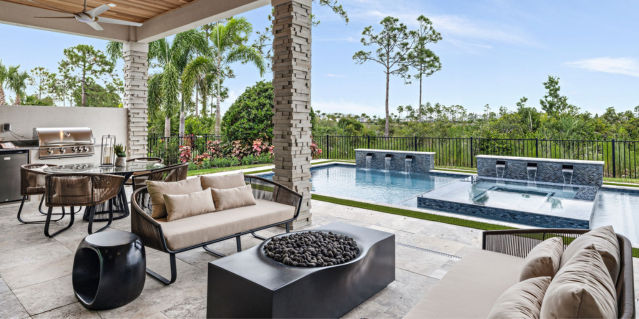 Lanai of home, with a pool and summer kitchen