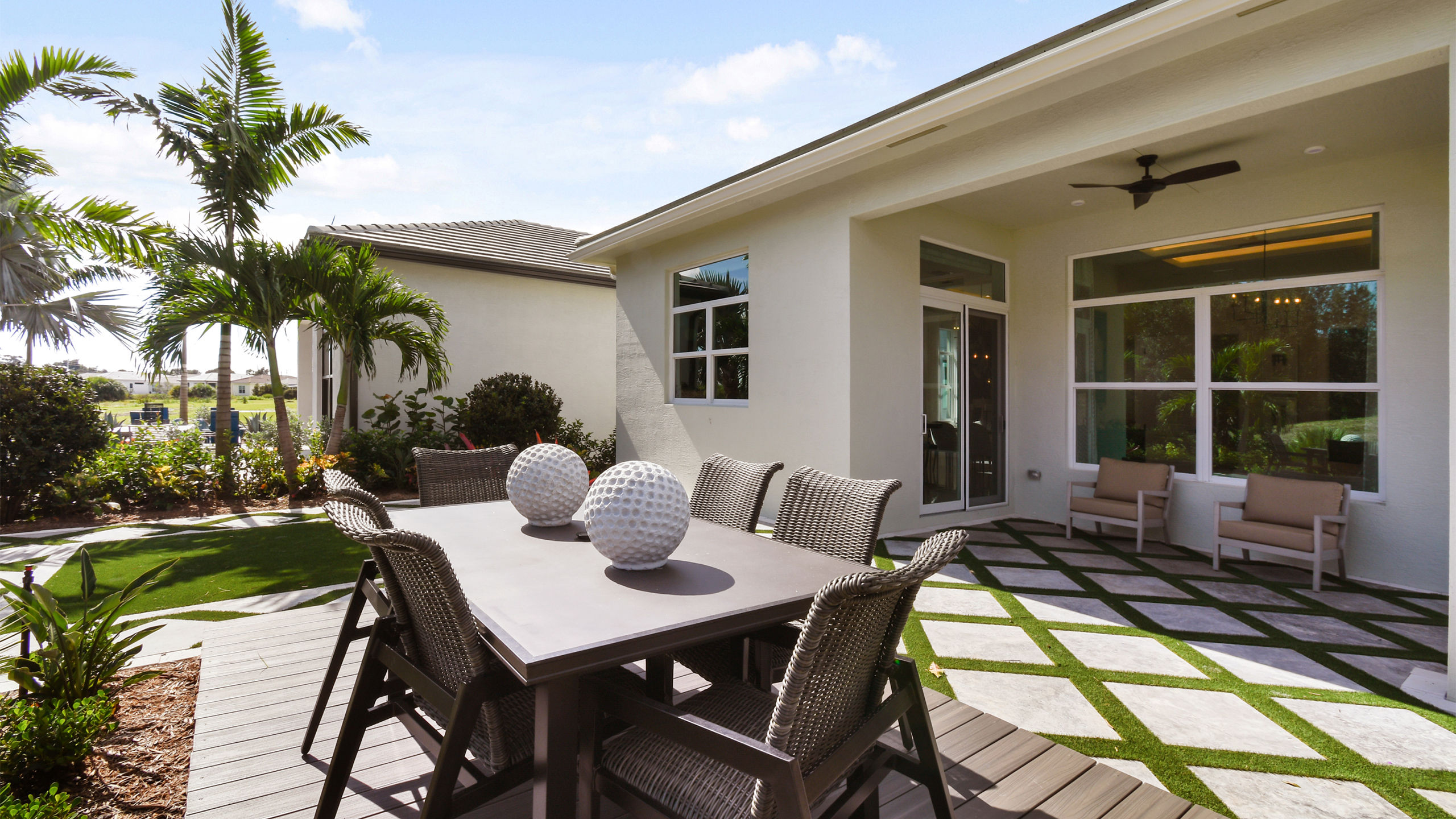 New construction home with outdoor living area at Rivella in Port St. Lucie, Florida