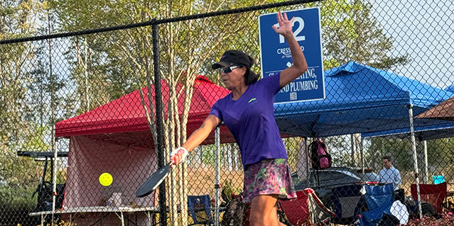 Woman Hitting Pickleball